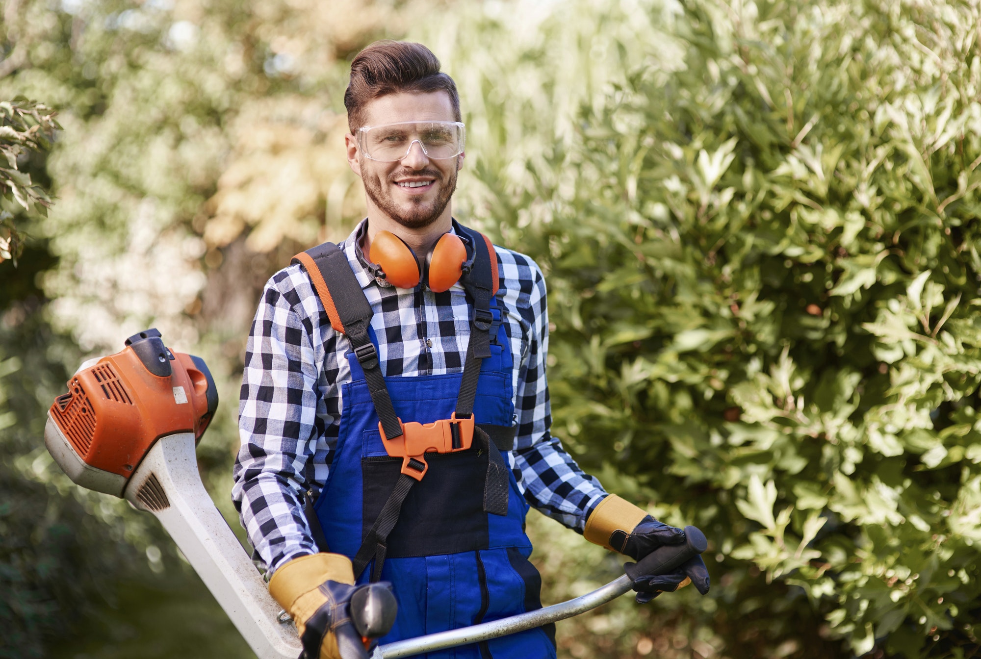 portrait-of-man-working-with-weedwacker.jpg